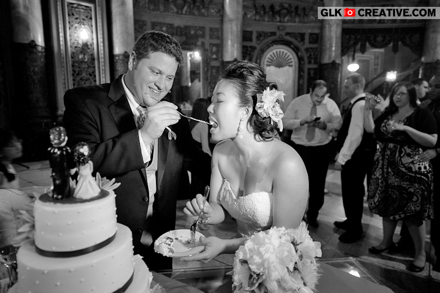 bride-groom-cutting-cake-at-landmark-loews-wedding